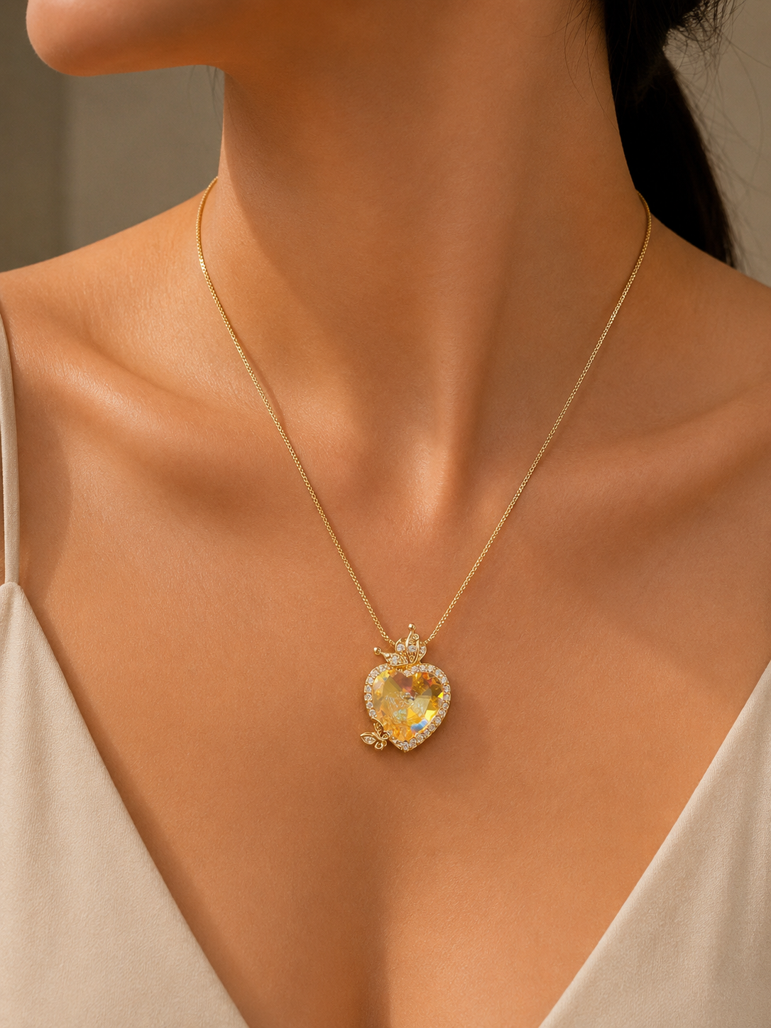 Gold Aurora Heart Crystal Butterfly Necklace worn around neck