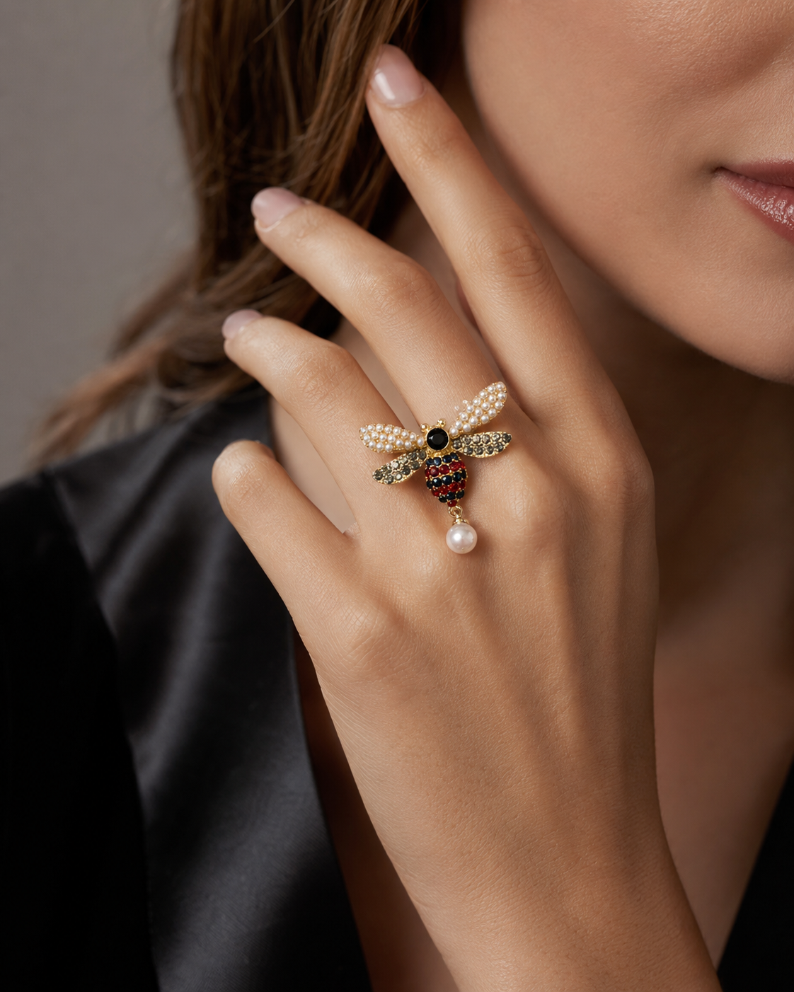 Pearl Bee Ring with Ruby Heart on purple fabric