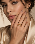 Gold Crystal Knot Double Band Ring worn on finger
