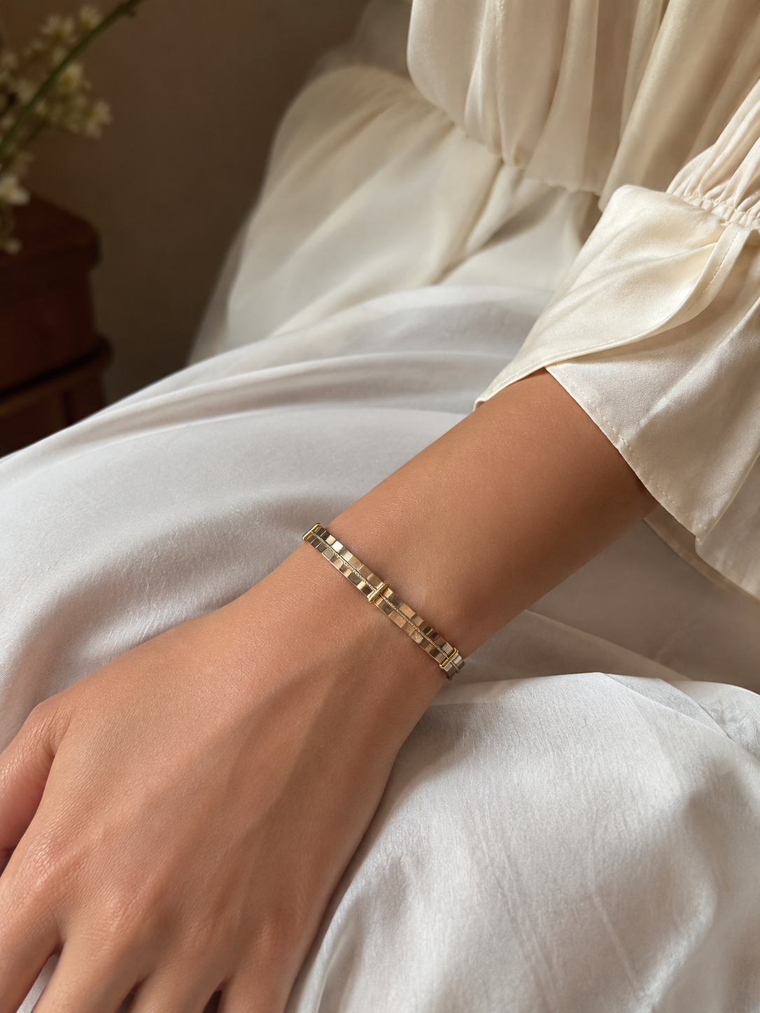 Gold Mirror-Polished Square Tile Open Cuff Bracelet worn on model with white linen shirt