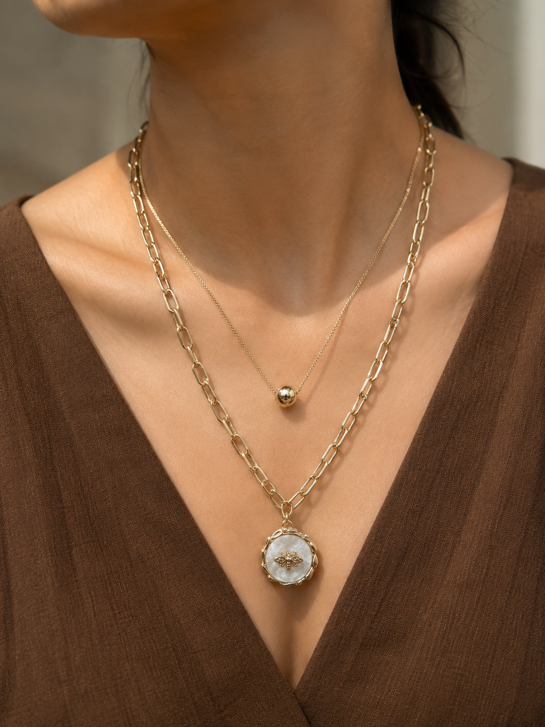 Gold Double-Layer Paperclip Chain Bee Medallion Necklace worn around neck