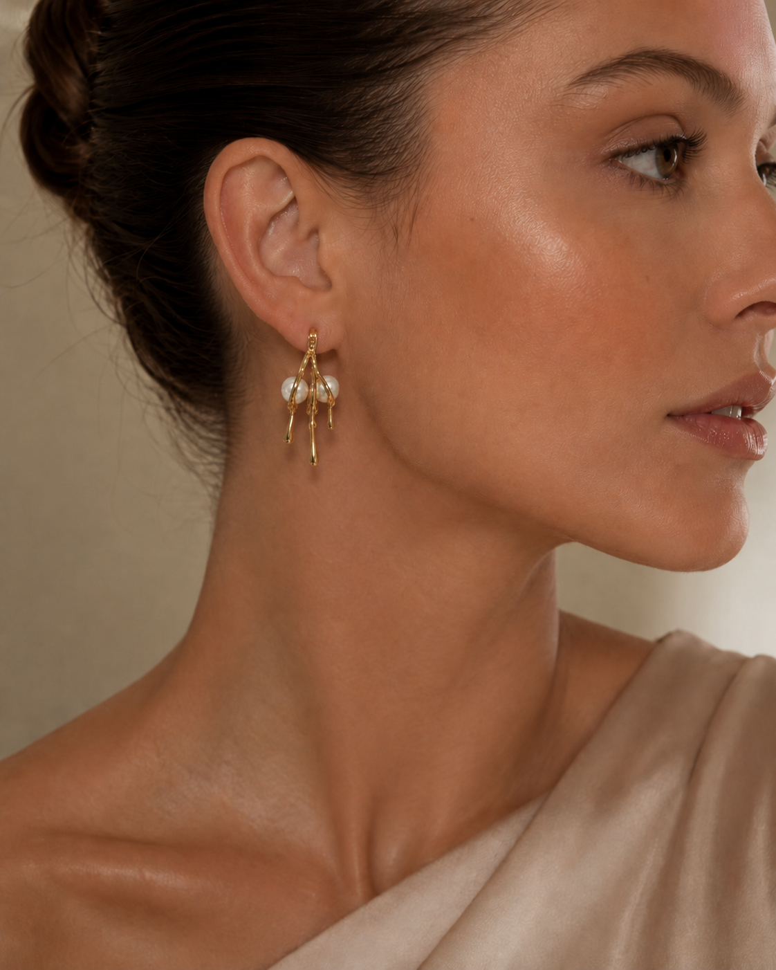 Gold Molten Drip Pearl Hoop Earrings worn on model with updo and silk top