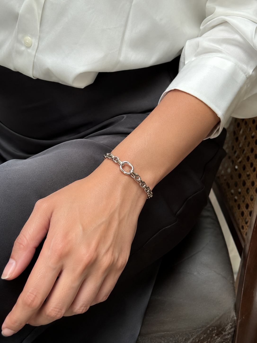 Silver Chunky Oval Link Chain Cuff Bracelet with O-Ring worn on wrist with white shirt