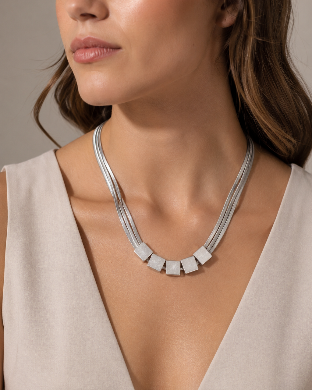 Silver Multi-Strand Herringbone Chain Necklace with Cube Bead Accents worn on model