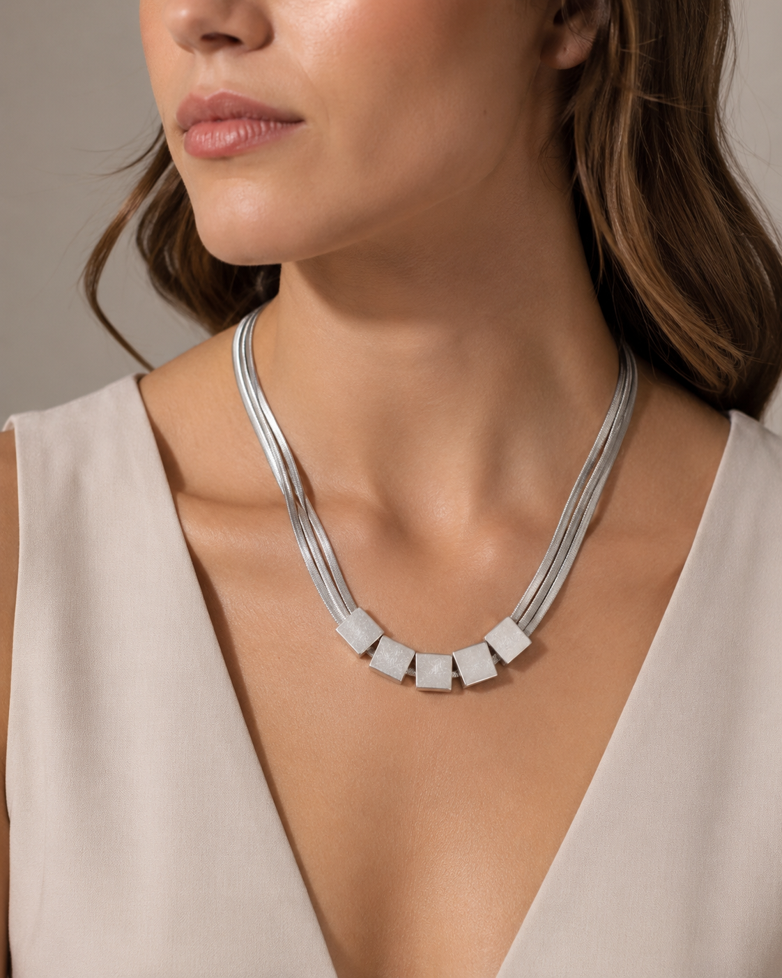 Silver Multi-Strand Herringbone Chain Necklace with Cube Bead Accents worn on model