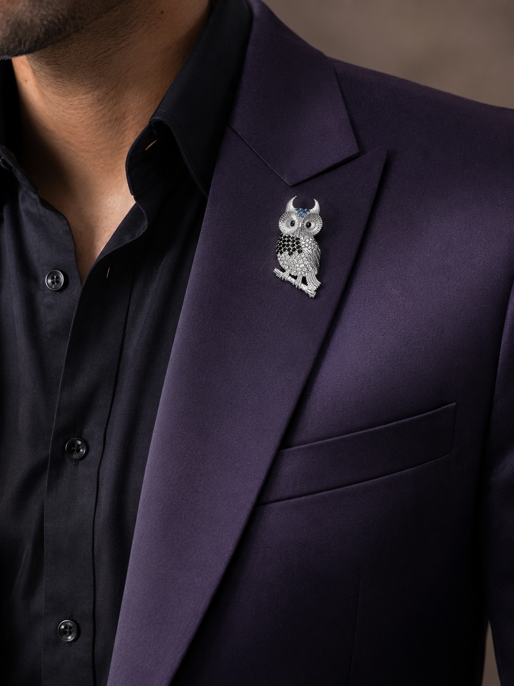 Silver Black & White Pavé Owl Lapel Brooch Pin worn on model on navy blazer lapel with black shirt