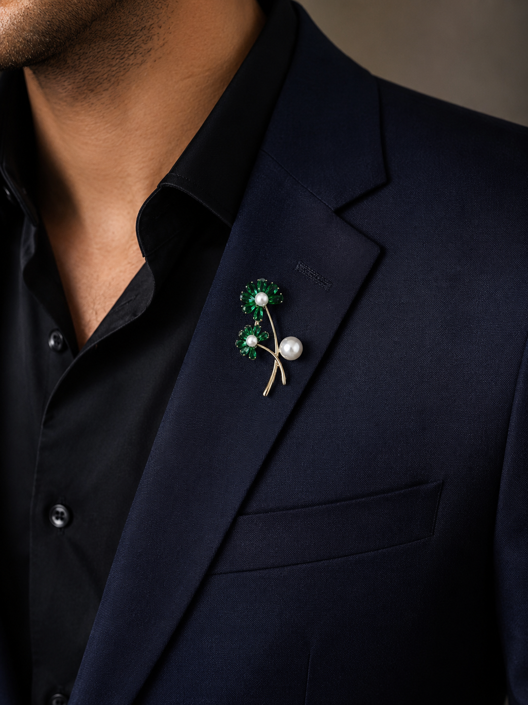 Gold Emerald Crystal Daisy Double Bloom & Pearl Lapel Brooch Pin worn on model on navy blazer lapel with black shirt