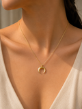 Gold Crescent Moon Pendant Necklace worn around neck