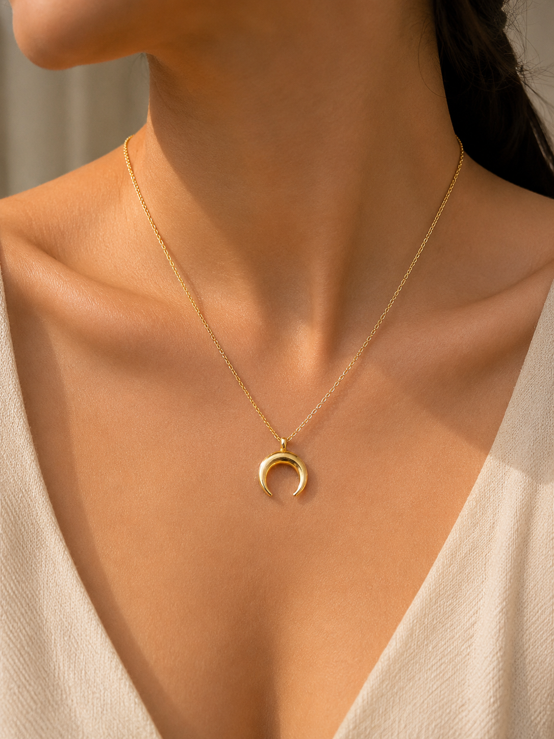 Gold Crescent Moon Pendant Necklace worn around neck