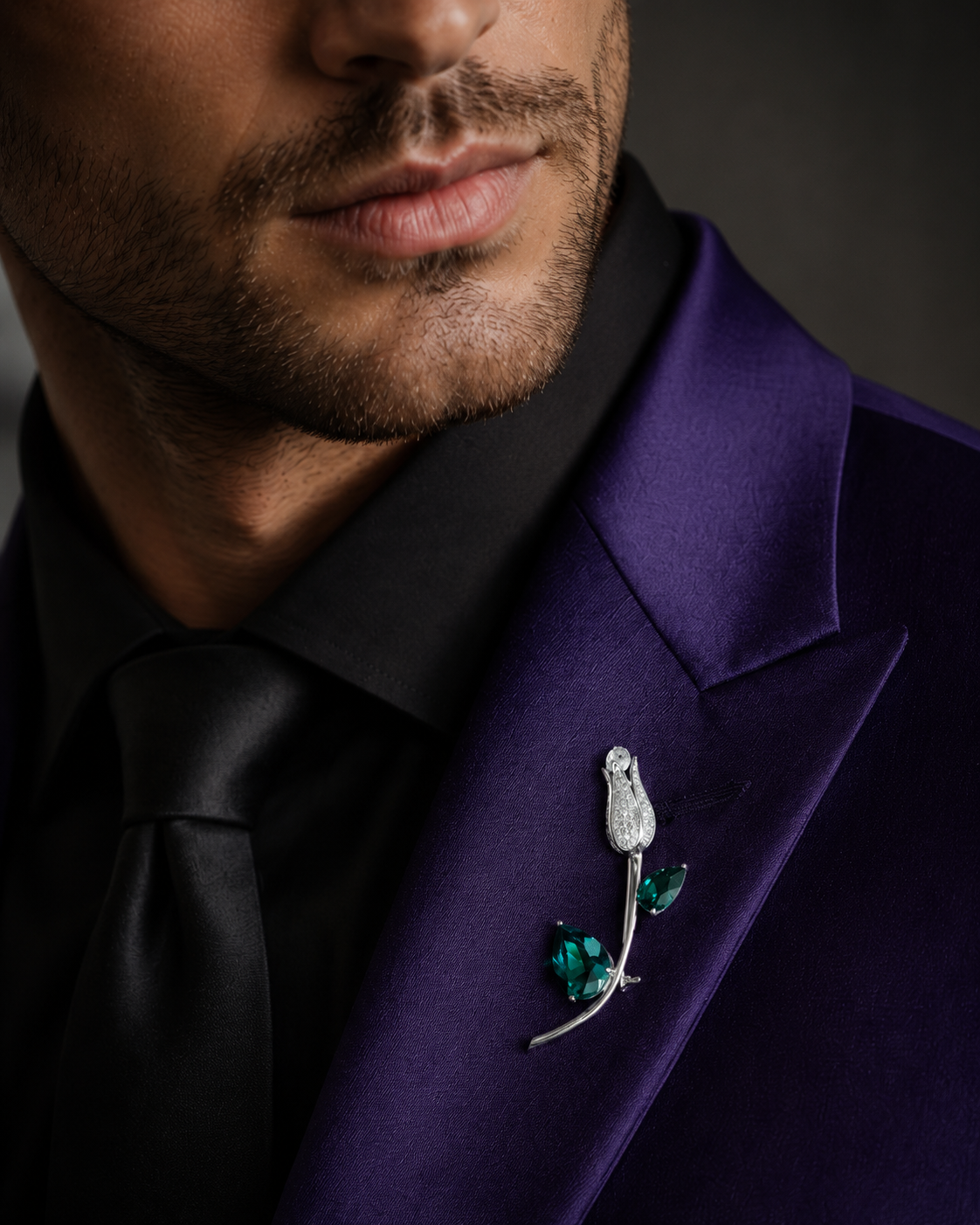Silver Emerald Crystal Tulip Bud & Leaf Lapel Brooch Pin worn on model on purple blazer lapel with black tie