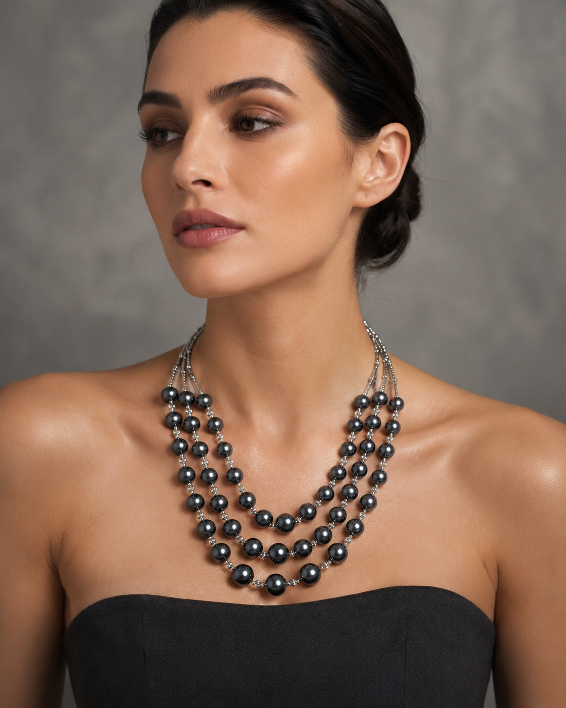 Silver Four-Strand Graduated Grey Pearl & Rondelle Spacer Necklace worn on model with black strapless gown