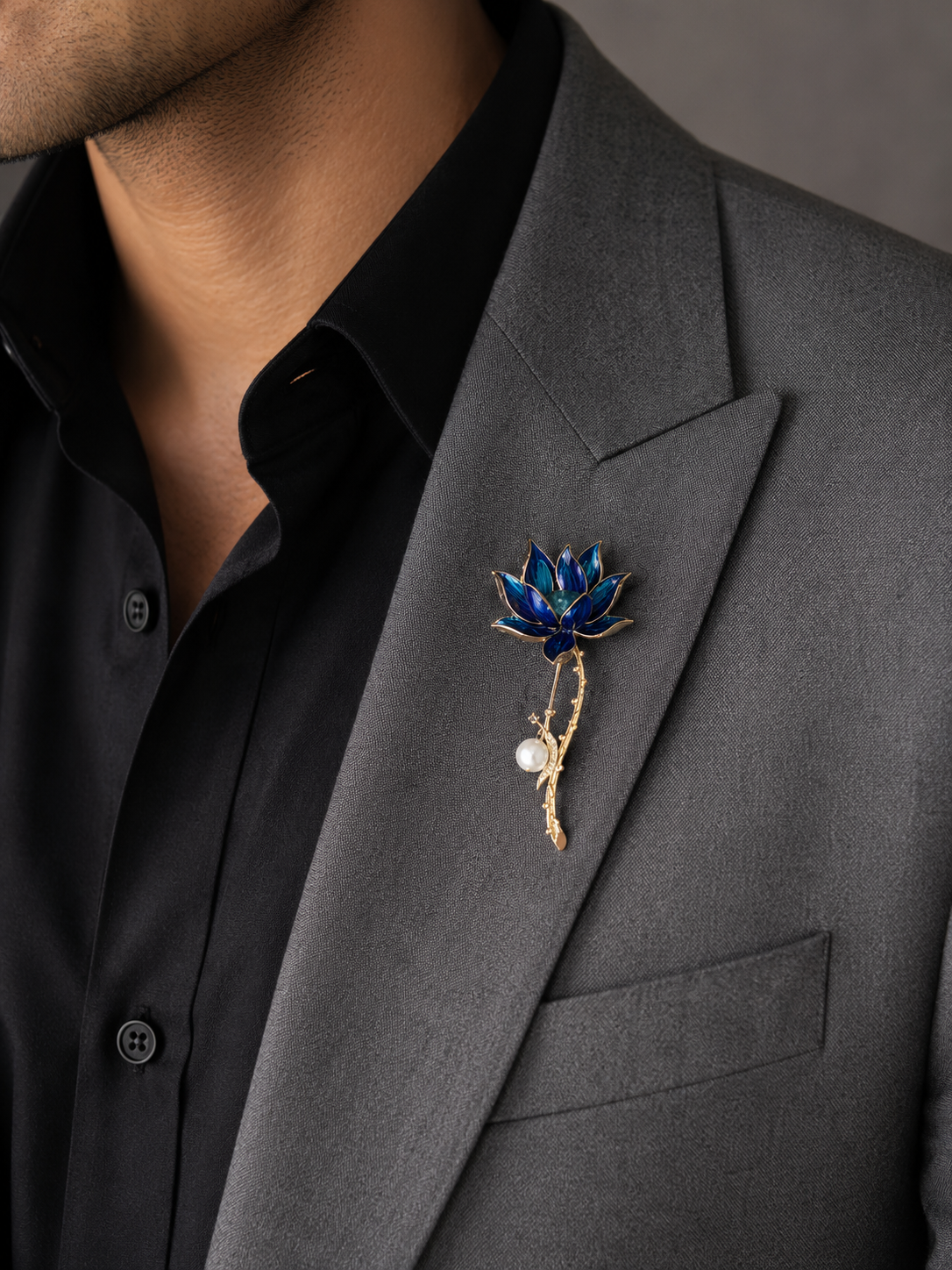 Gold Deep Blue Enamel Lotus Bloom Long Stem Lapel Brooch Pin worn on model on grey blazer lapel with black shirt