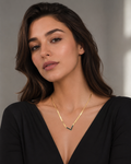 Gold Black Enamel V-Chevron Herringbone Chain Necklace worn on model with black deep V-neck top
