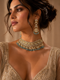 Gold Kundan Polki Wide Choker with Aqua Drops & Three-Tier Jhumka Earrings Set worn on model with champagne embroidered lehenga and updo