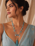 Turquoise Double-Strand Tumbled Bead & Teardrop Long Tassel Necklace worn on model with powder blue saree and updo