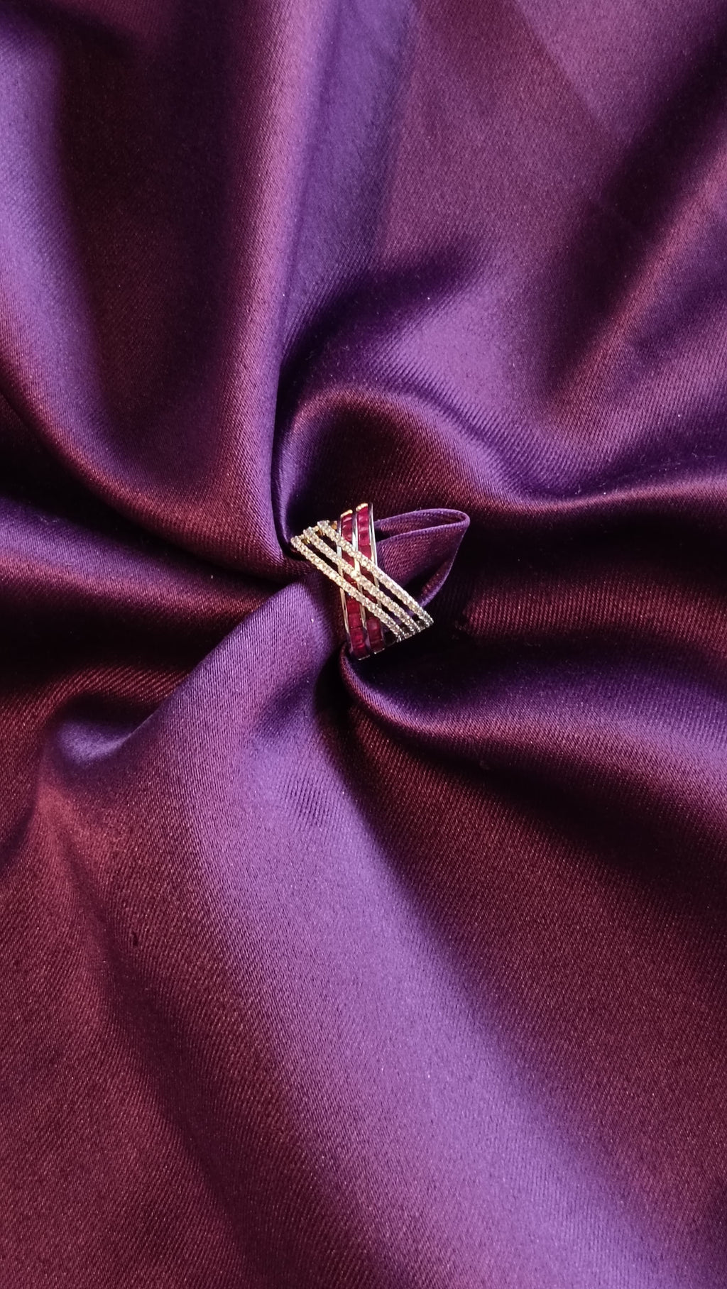 Gold Ruby Red Multi-Strand Crossover Ring side view on purple fabric