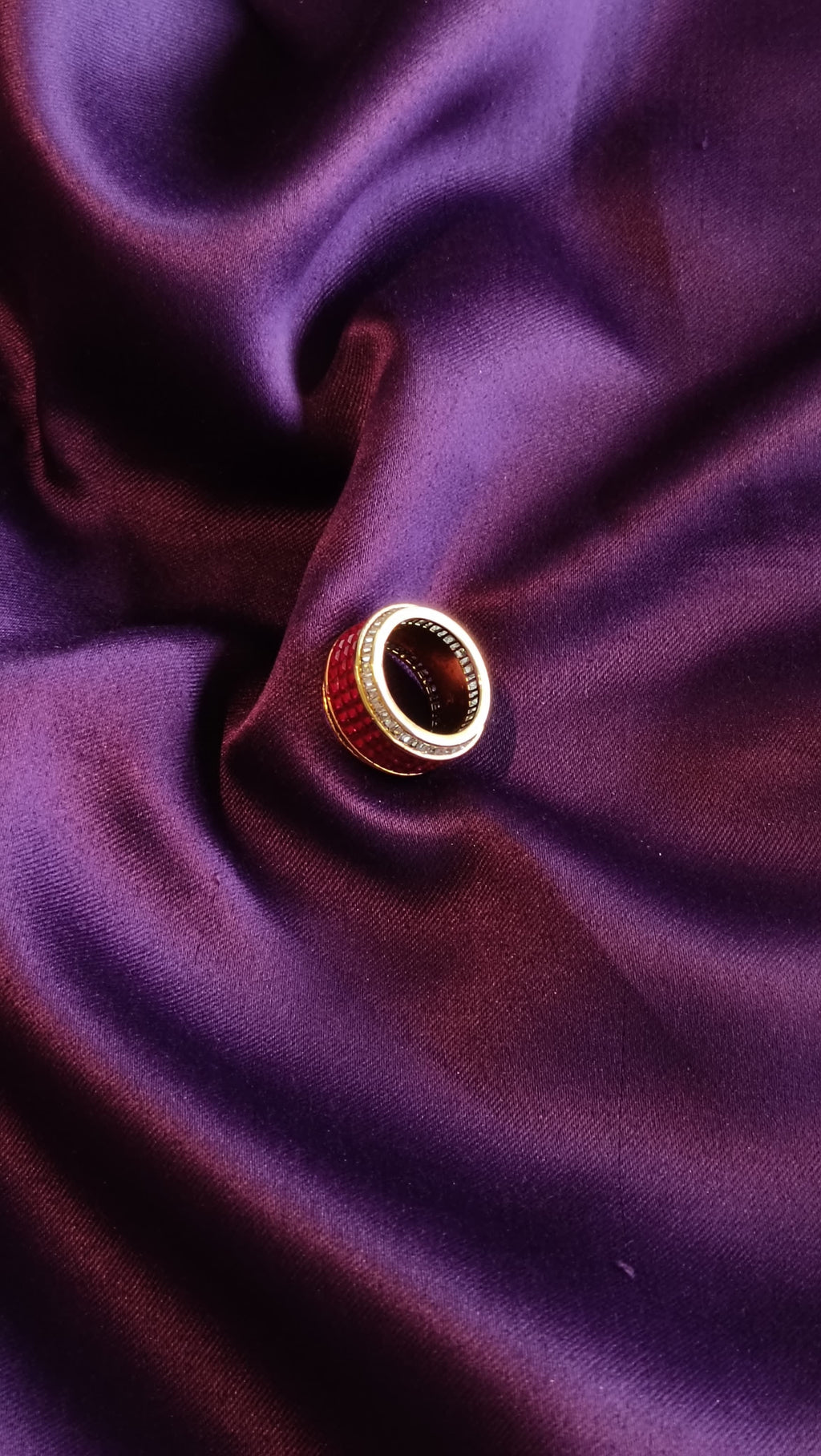 Gold Ruby Red Enamel & Pavé Crystal Wide Band Ring side view on purple fabric