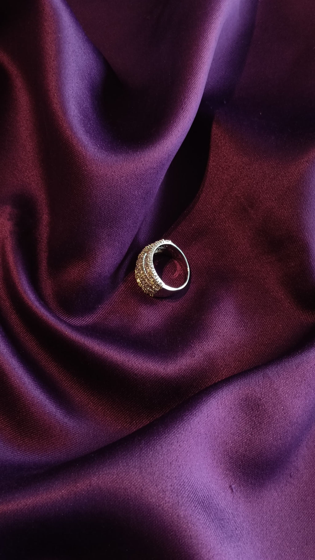 Gold Triple-Row Pavé Crystal Dome Band side view on purple fabric