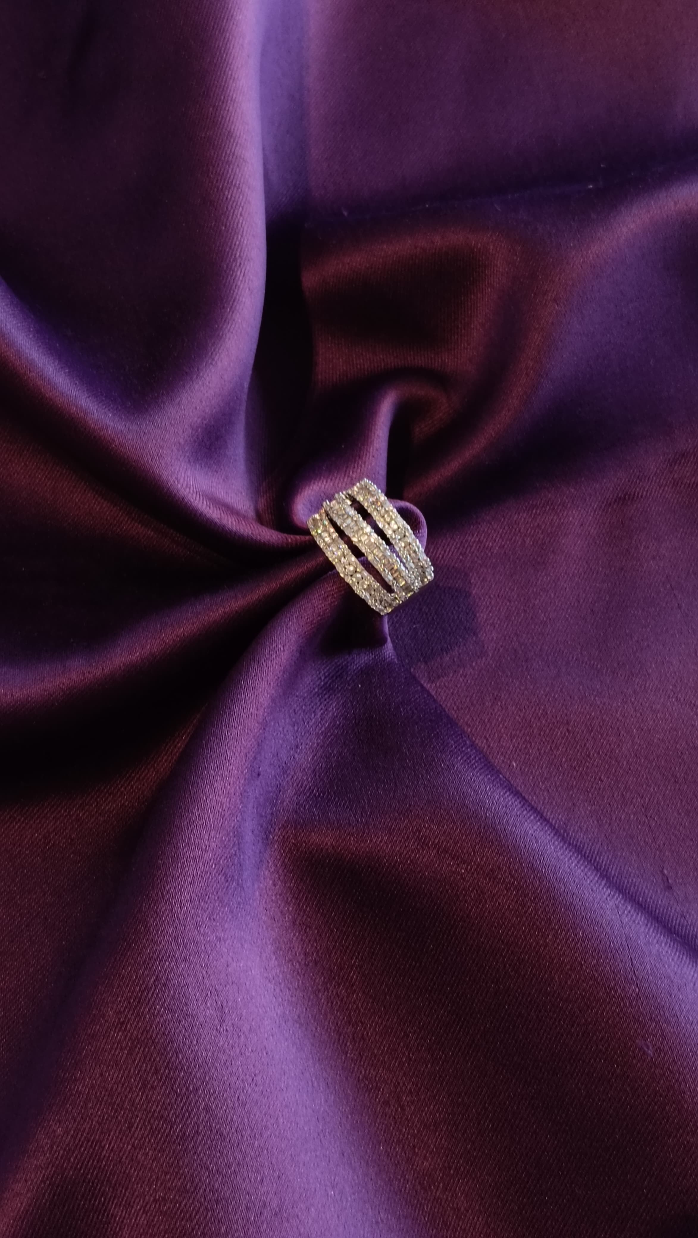 Gold Triple-Row Pavé Crystal Dome Band top view on purple fabric