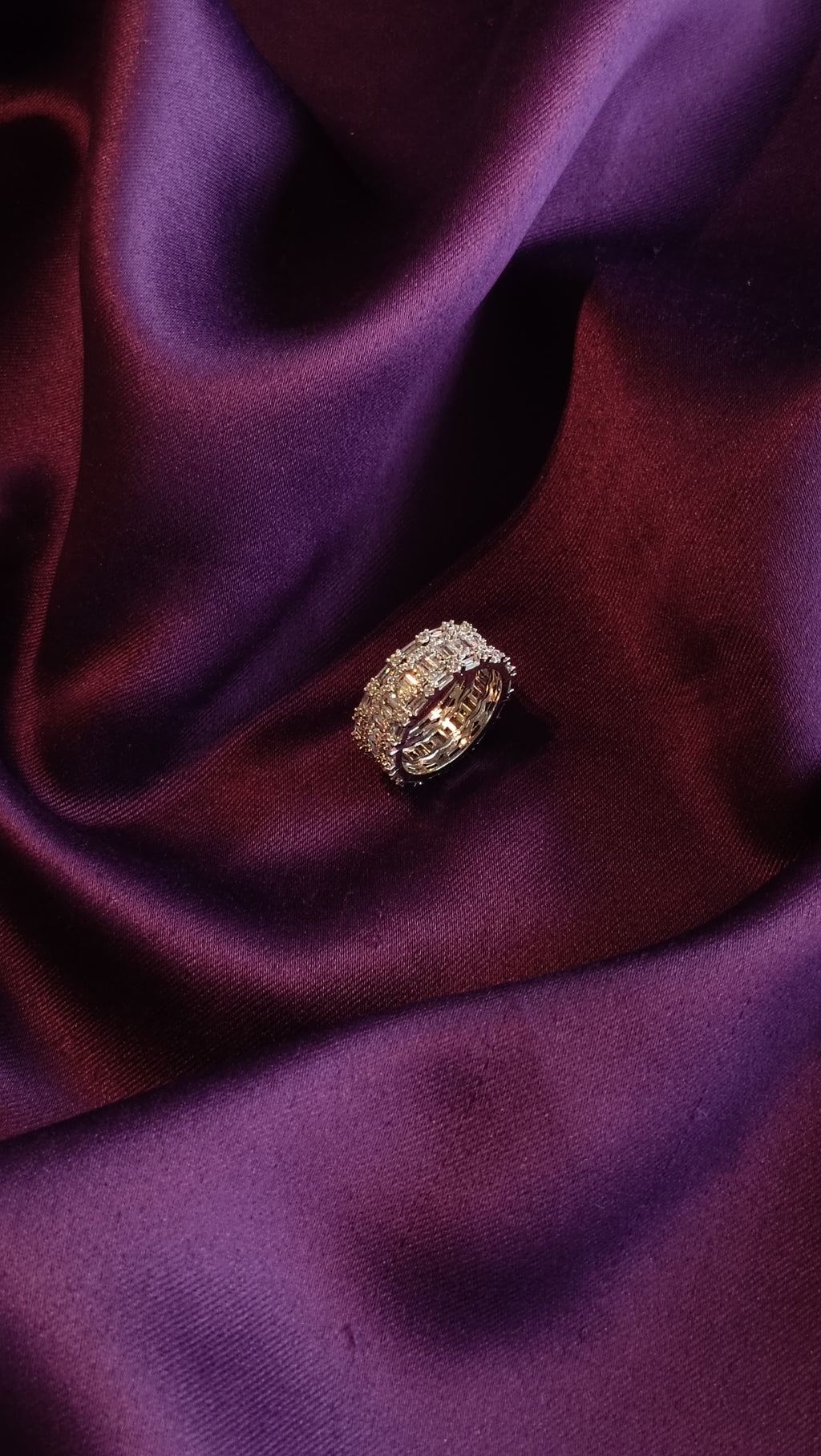 Gold Baguette & Pavé Wide Eternity Band side view on purple fabric