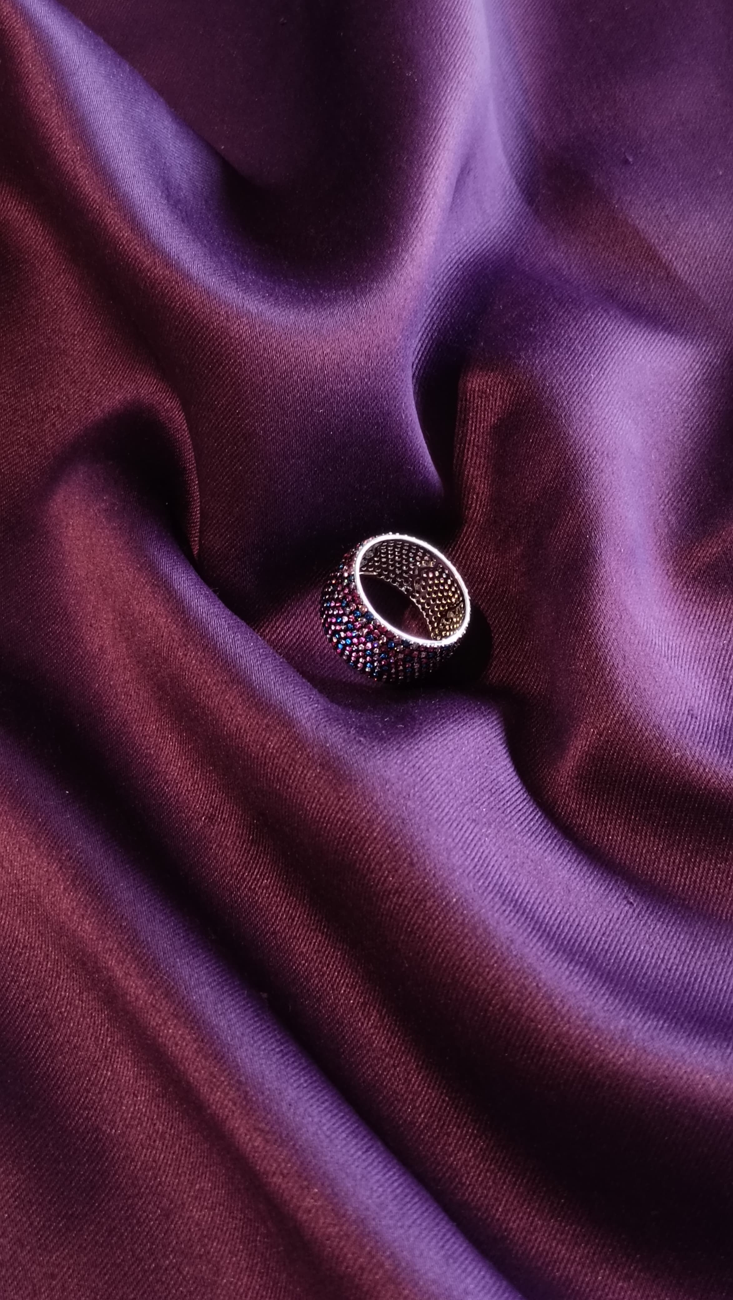 Multi-Colour Pavé Wide Dome Band Ring top view on purple fabric