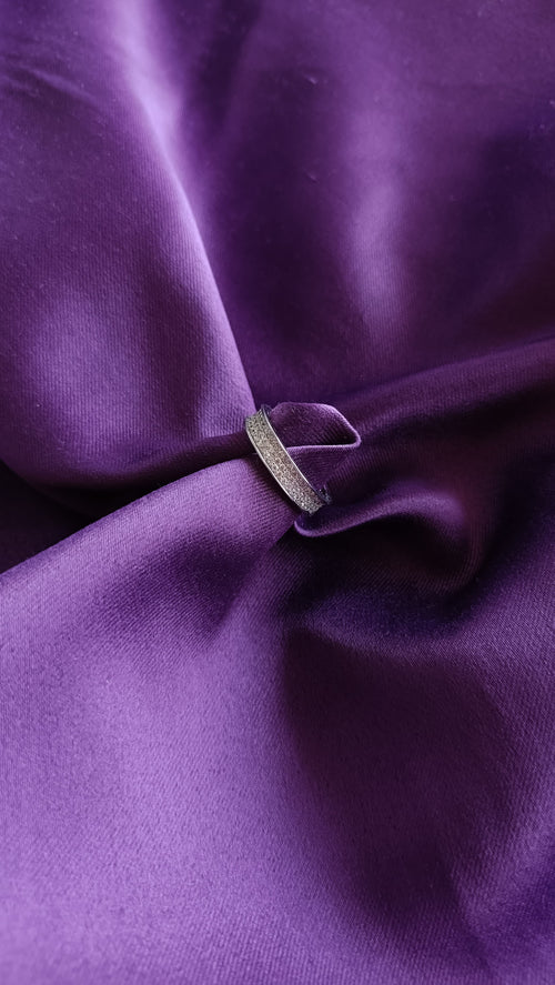 Double Row Pavé Crystal Band Ring on purple fabric close-up