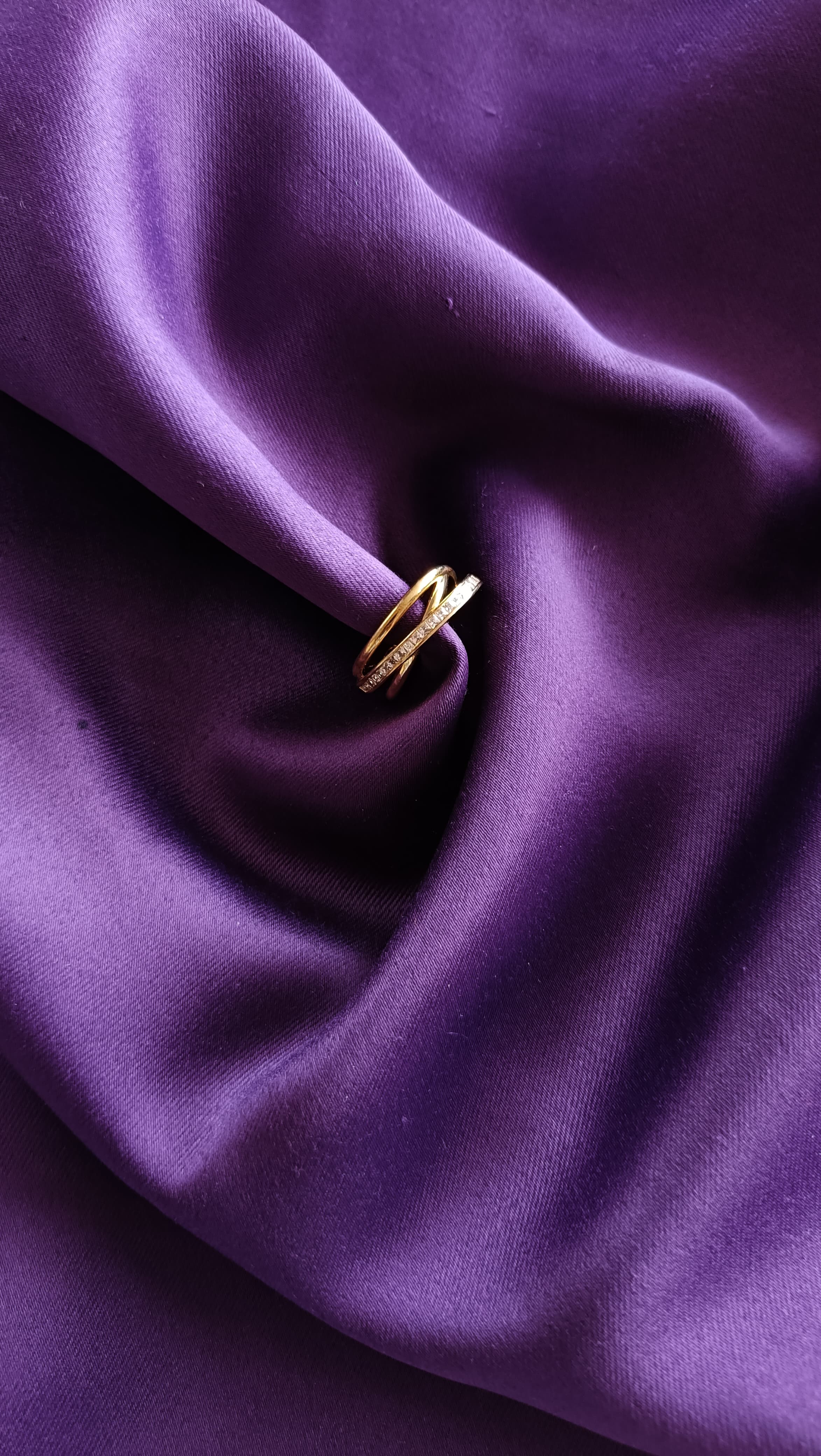 Gold Triple Band Pavé Ring on purple fabric close-up