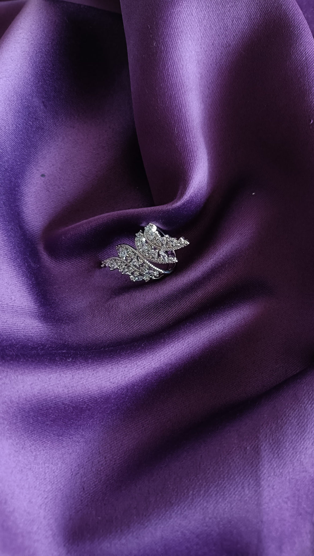 Crystal Maple Leaf Statement Ring on purple fabric close-up