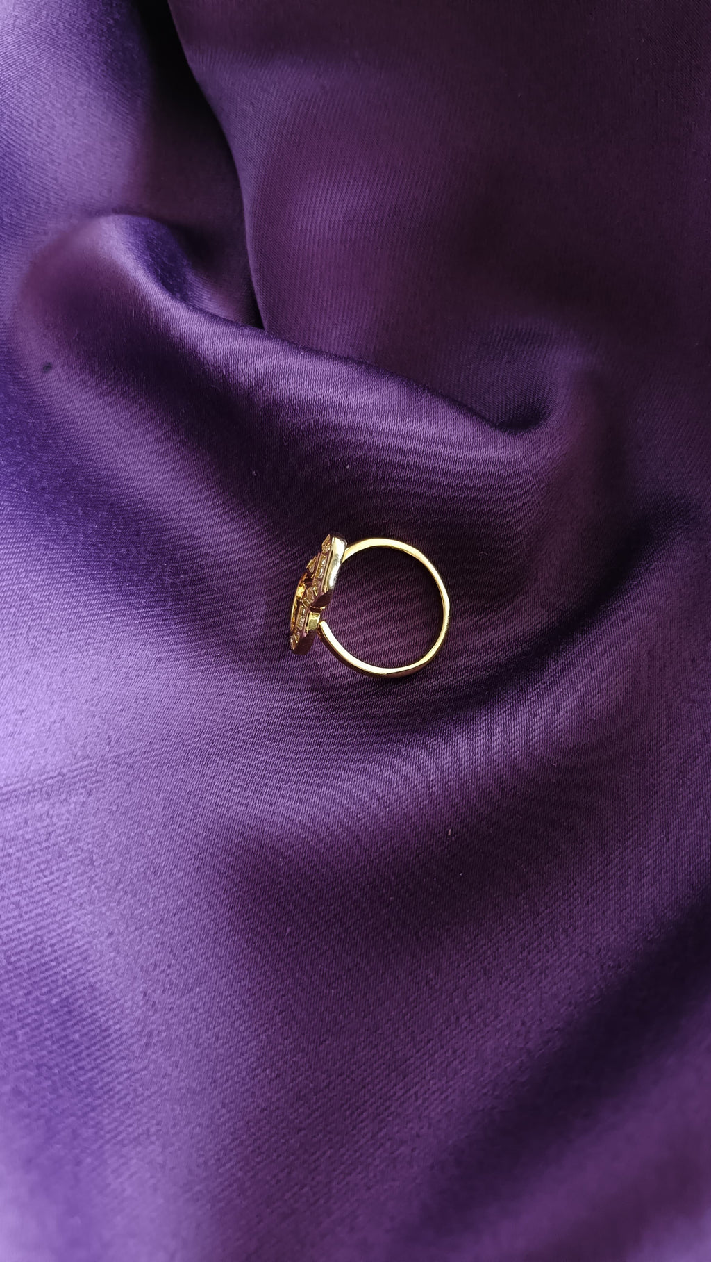 Gold Open Wave Baguette Ring side view on purple fabric
