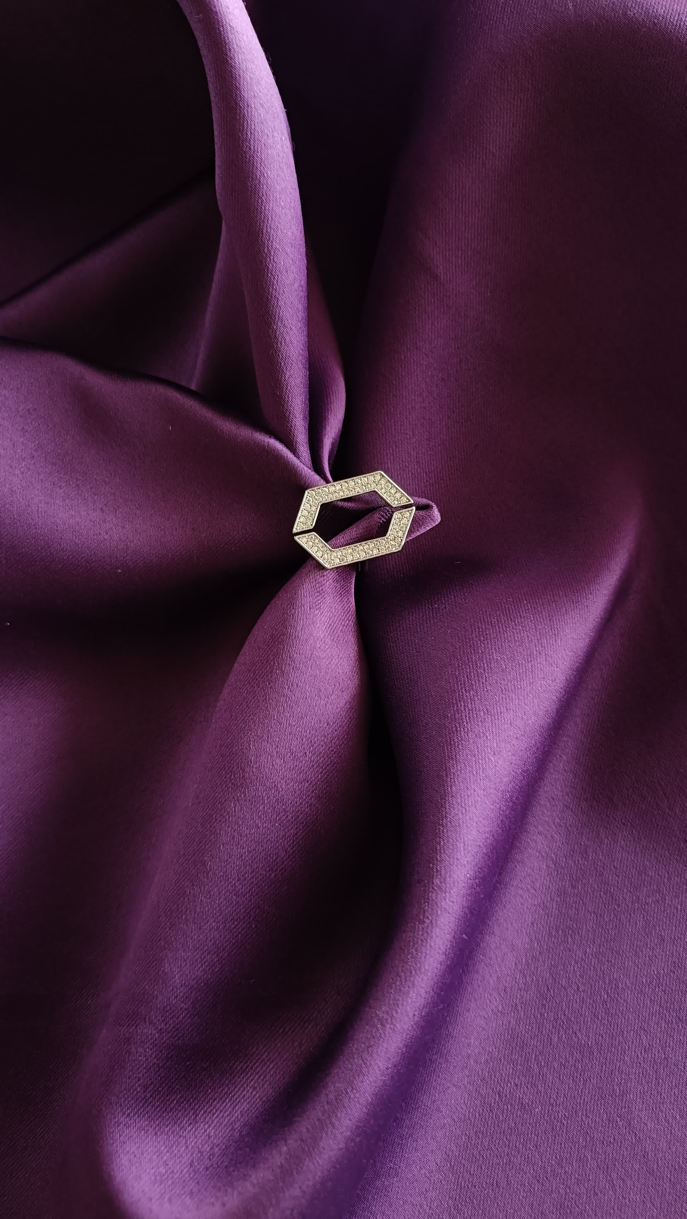 Gold Open Hexagon Pavé Ring flat lay on purple fabric