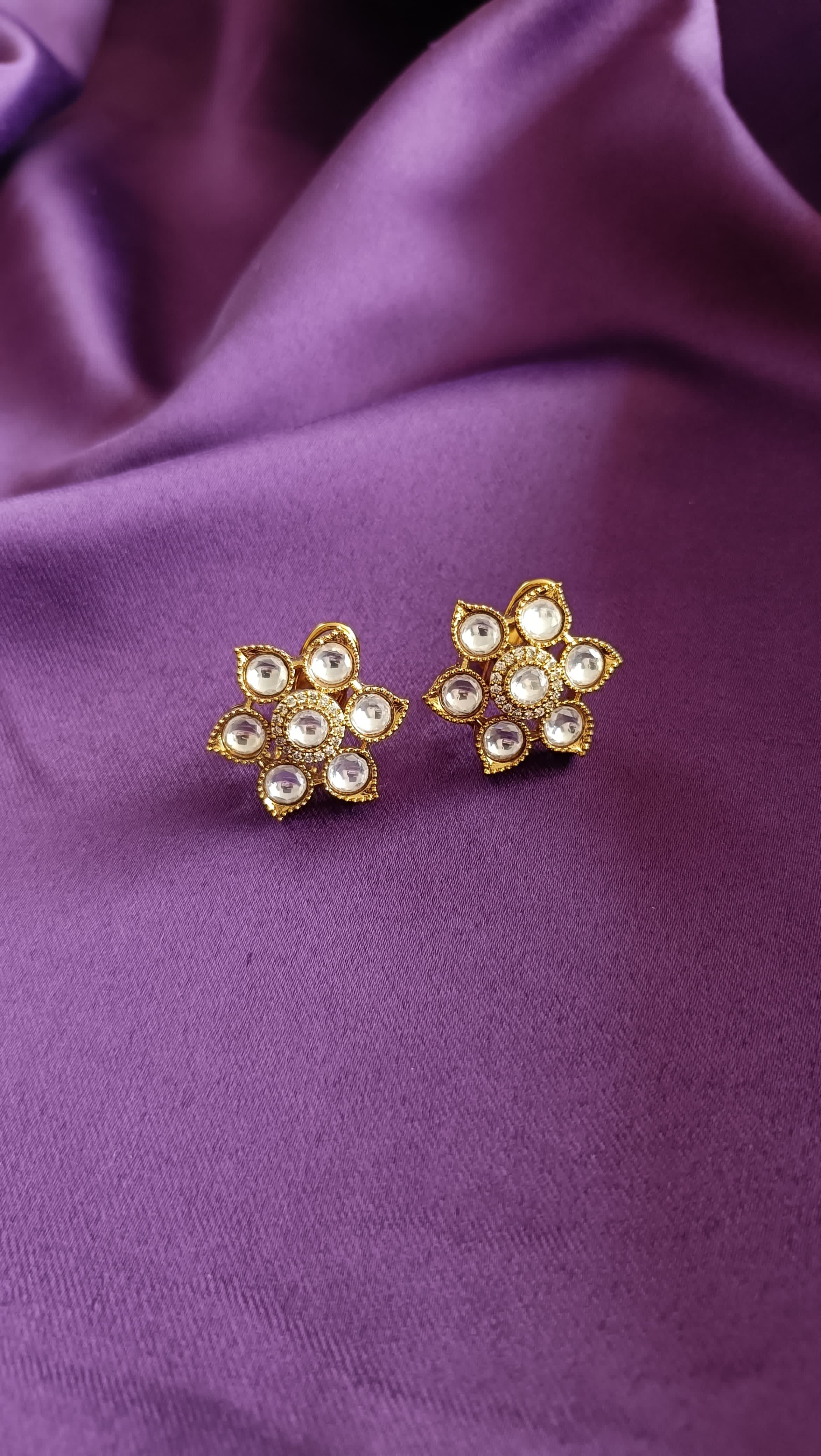 Gold Double-Row Square Kundan Polki Choker & Floral Stud Earrings Set full flat lay on purple fabric