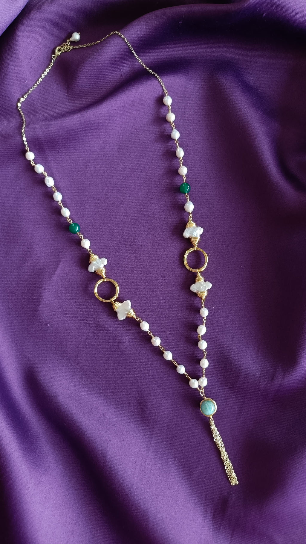 Gold Wire-Wrapped Mother-of-Pearl Flower & Green Onyx Long Lariat Necklace full length flat lay on purple fabric showing lobster clasp and extender