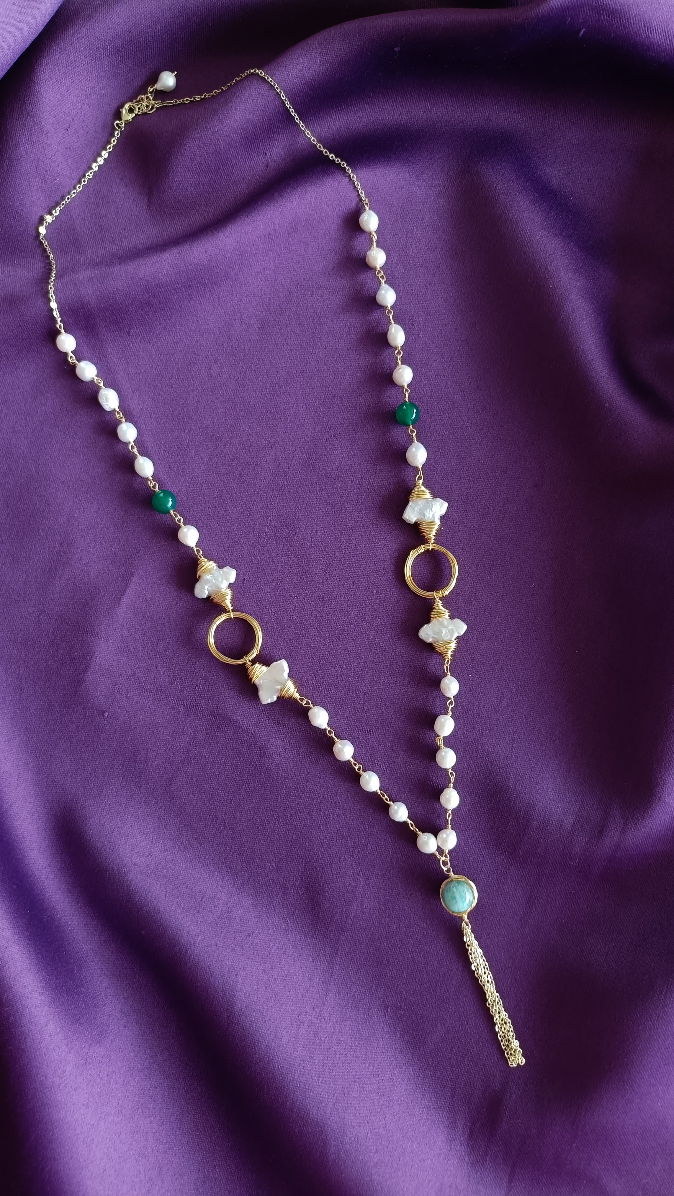 Gold Wire-Wrapped Mother-of-Pearl Flower & Green Onyx Long Lariat Necklace full length flat lay on purple fabric showing lobster clasp and extender