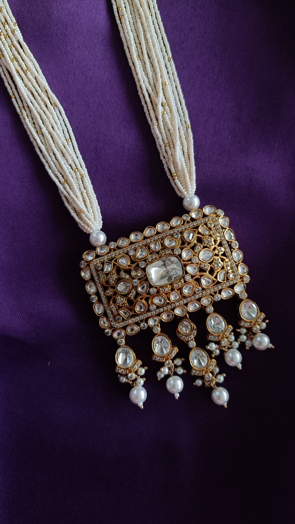 Gold Kundan Polki Rectangular Stud Earrings with Pearl Drops front and back detail flat lay on purple fabric