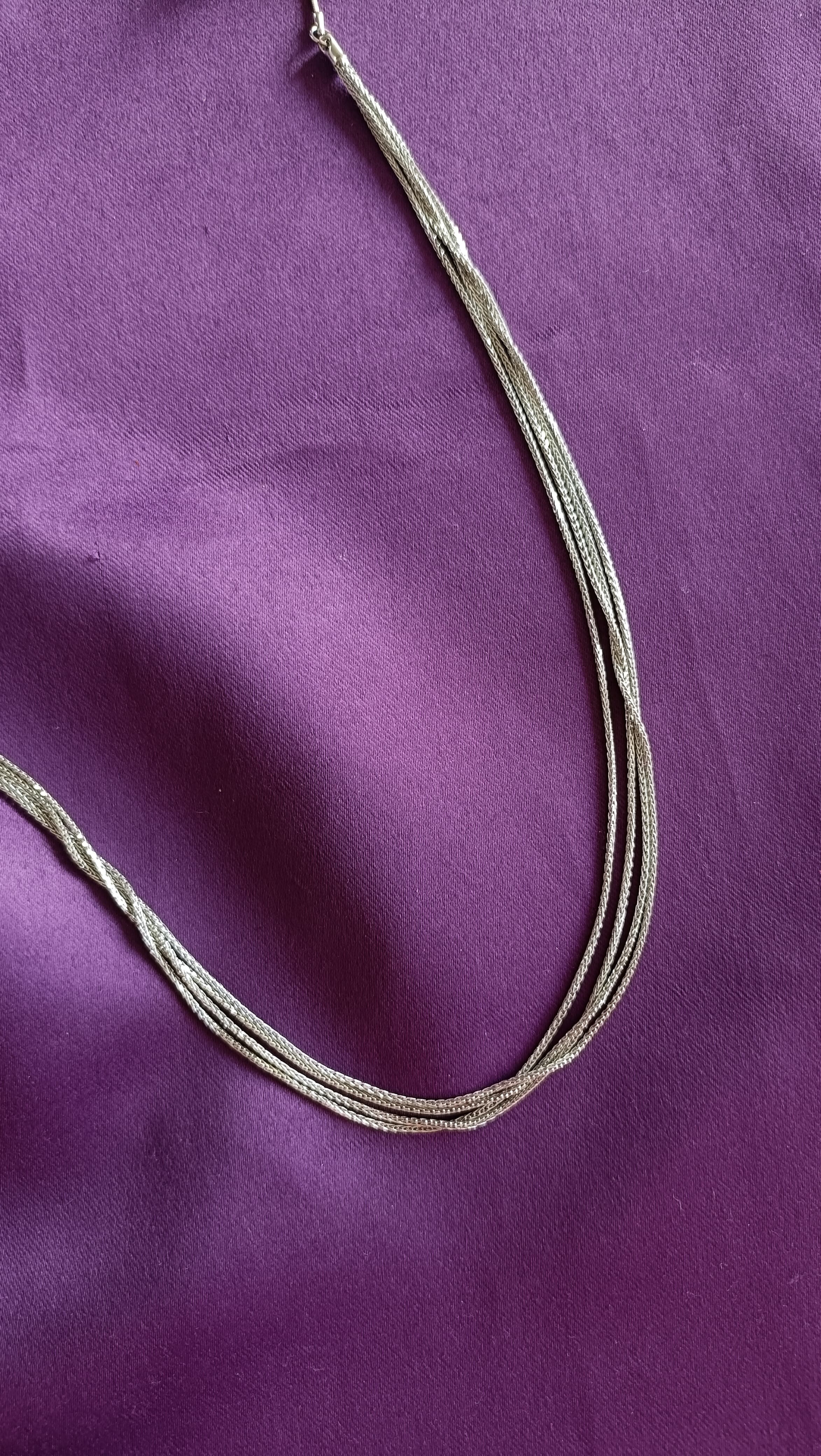 Silver Pearl & Ball Station Long Tassel Chain Necklace tassel detail flat lay on purple fabric