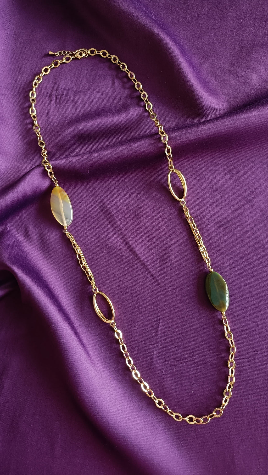 Gold Mixed-Chain Green Onyx & Honey Agate Oval Station Long Necklace full length flat lay on purple fabric showing lobster clasp and extender