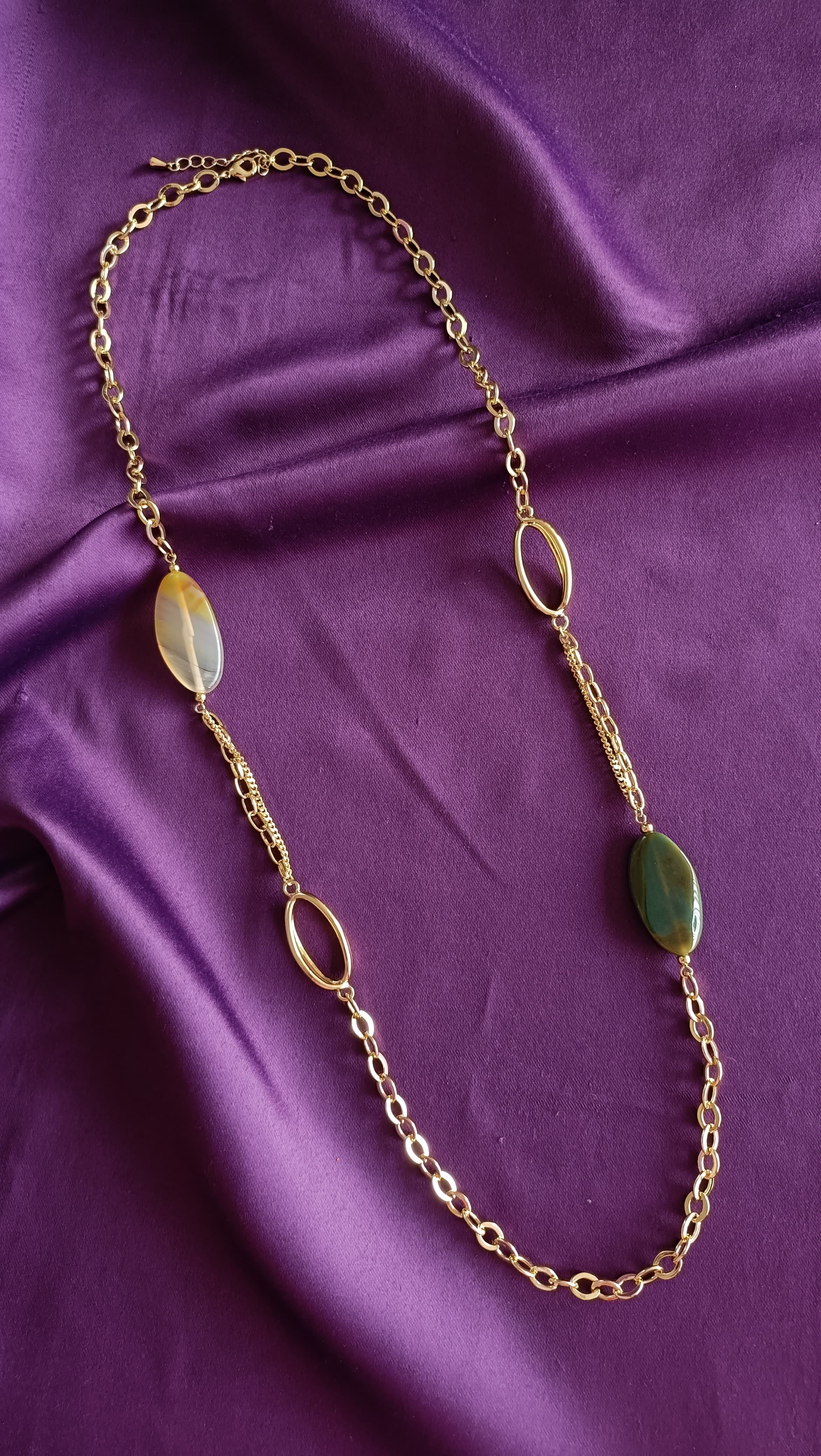 Gold Mixed-Chain Green Onyx & Honey Agate Oval Station Long Necklace full length flat lay on purple fabric showing lobster clasp and extender