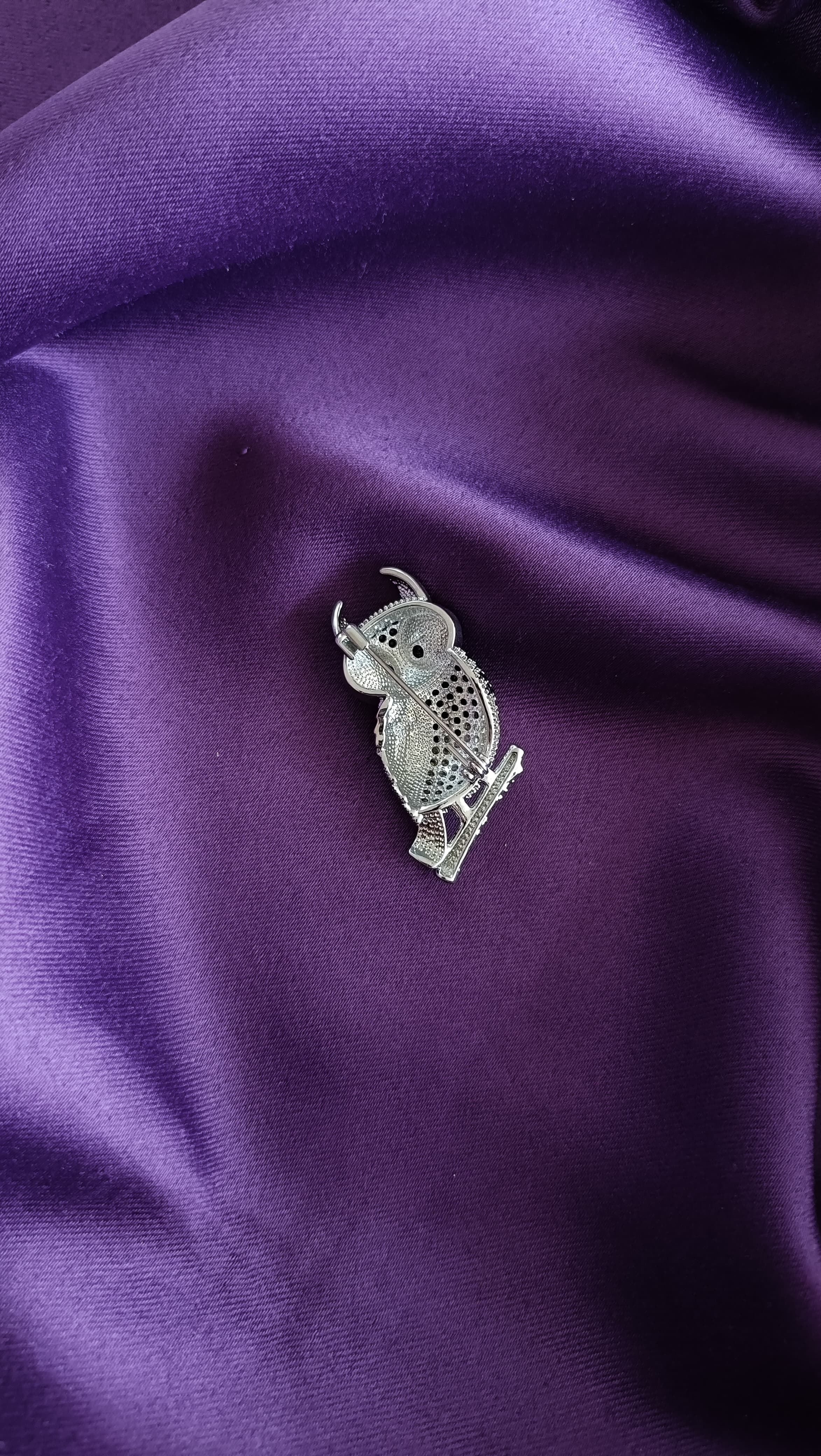 Silver Black & White Pavé Owl Lapel Brooch Pin reverse side flat lay on purple fabric showing pin back closure