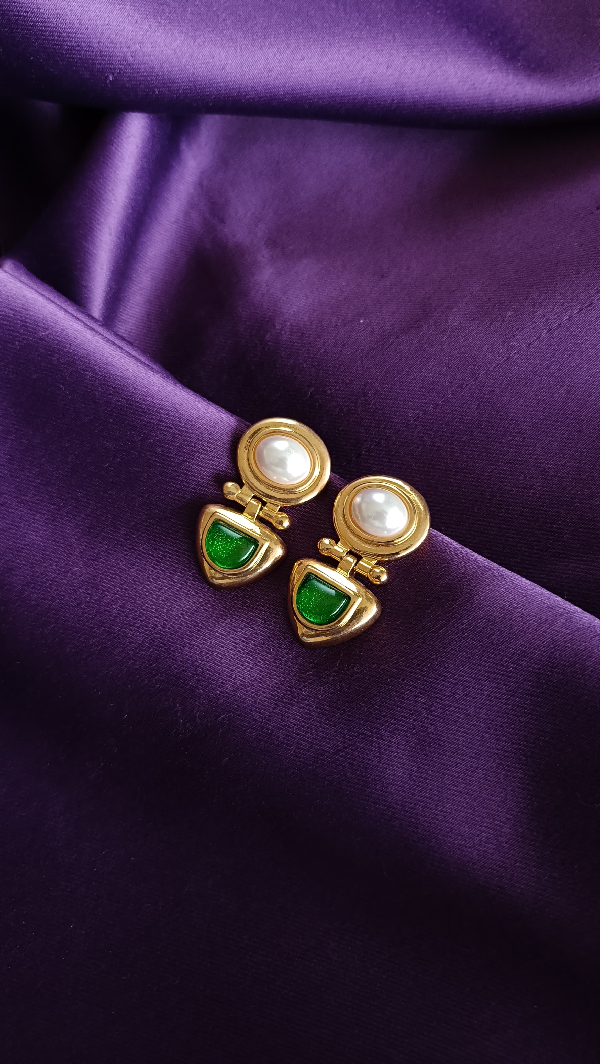 Gold Pearl & Emerald Green Cabochon Hinged Drop Earrings pair close-up flat lay on purple fabric