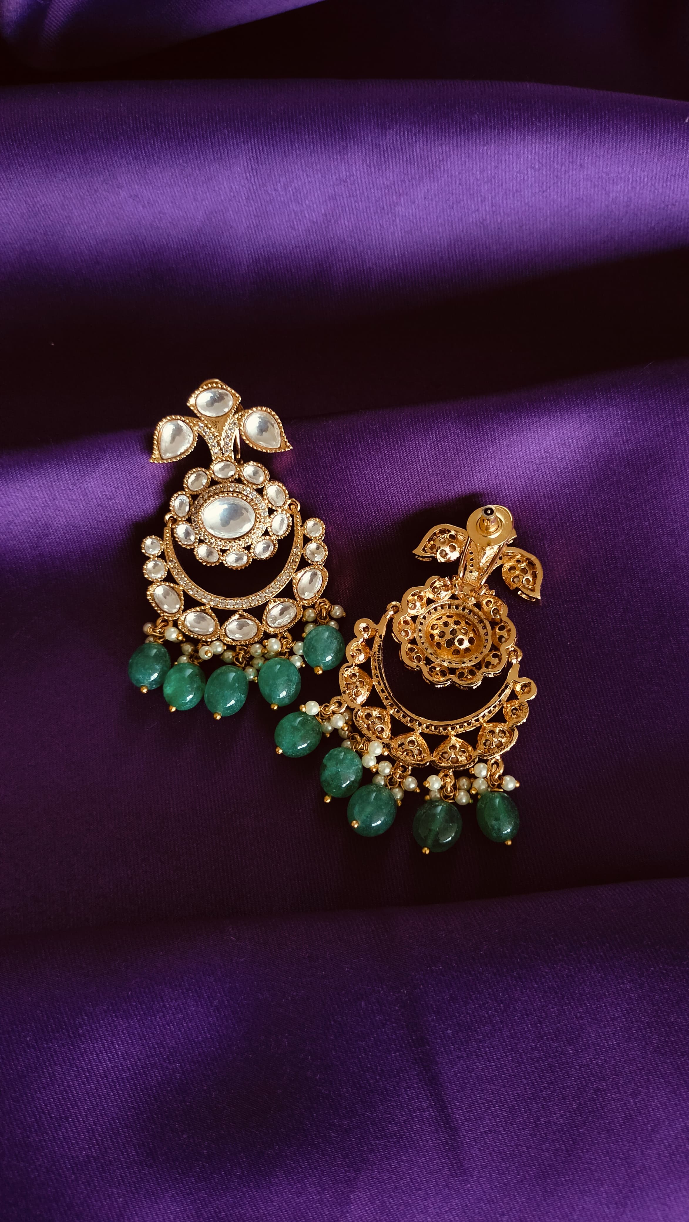 Gold Kundan Polki Chandbali Earrings front and back detail flat lay on purple fabric